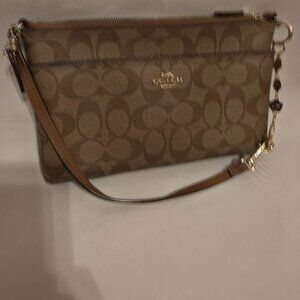 COACH CLUTCH HORSE AND CARRIAGE LIGHT CORNER WEAR SHOWN